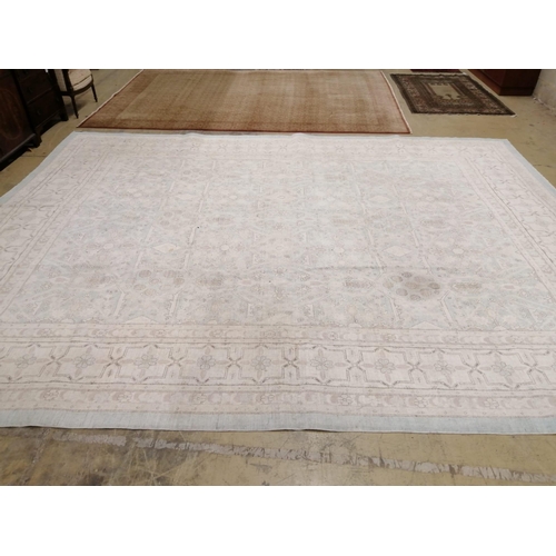 1017 - A modern North West Persian design aquamarine and ivory ground carpet, 480 x 370cm