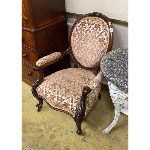 1023 - A Victorian carved walnut spoon back open armchair, width 71cm, depth 60cm, height 95cm