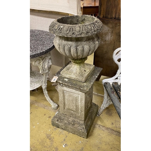 1025 - A circular reconstituted stone campana garden urn on square pedestal, height 95cm