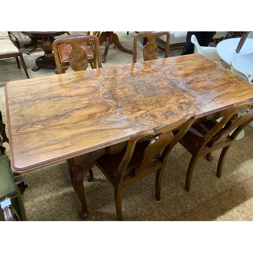 1031 - A Queen Anne revival figured walnut extending dining table, length 183cm extended, one spare leaf, w... 