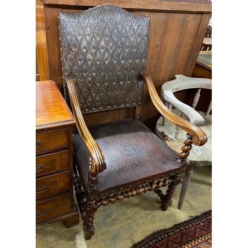 1041 - A French 19th century walnut and leather fauteuil, width 59cm, depth 60cm, height 115cm