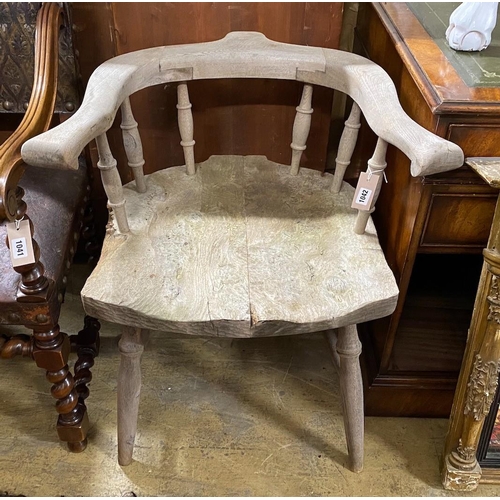 1042 - A primitive ash and elm armchair, width 69cm, depth 60cm, height 72cm