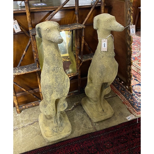 1045 - A pair of reconstituted stone seated greyhound garden ornaments, height 74cm