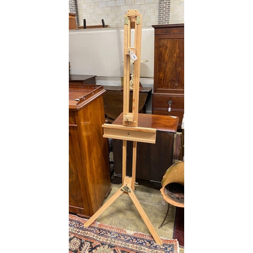 1050 - A modern brass mounted beech artist's studio easel, height 180cm