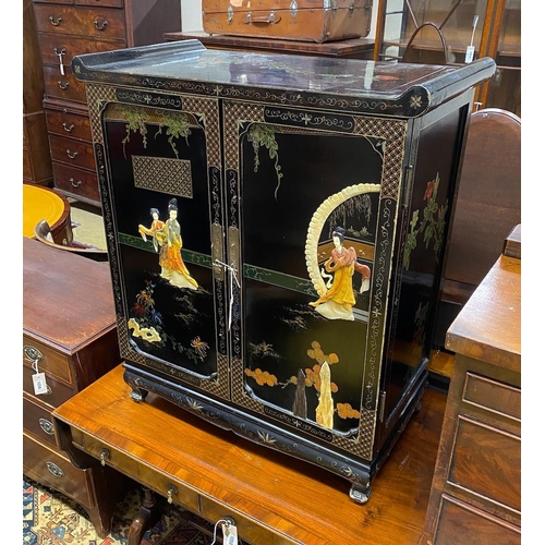 1057 - A Chinese black lacquer hardstone and composition mounted two door side cabinet, width 77cm, depth 4... 