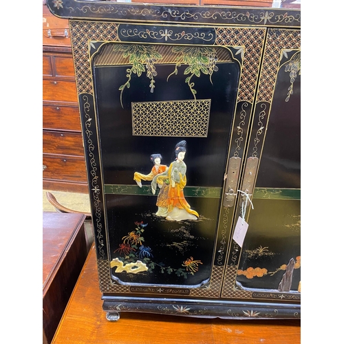 1057 - A Chinese black lacquer hardstone and composition mounted two door side cabinet, width 77cm, depth 4... 