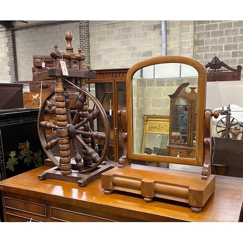 1059 - A Provincial turned beech spinning wheel and a Victorian mahogany toilet mirror, larger height 74cm... 