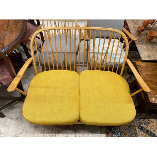 1082 - A mid century Ercol light beech three piece lounge suite, lacks three back cushions, settee length 1... 