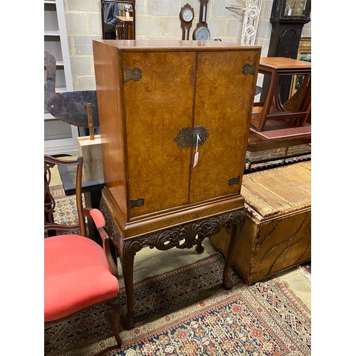 1086 - A Queen Anne style burr walnut cocktail cabinet, width 74cm, depth 46cm, height 145cm