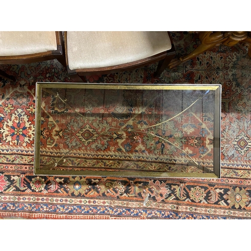 1096 - A rectangular gilt metal and smoked glass coffee table, width 91cm, depth 46cm, height 41cm