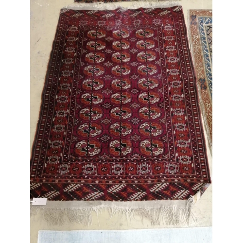 1104 - A Bokhara rug together with a Caucasian prayer mat, larger 150 x 104cm