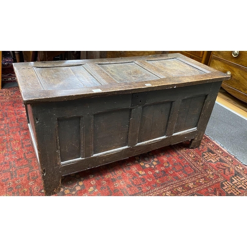 1184 - An 18th century panelled oak coffer, length 122cm, depth 52cm, height 59cm