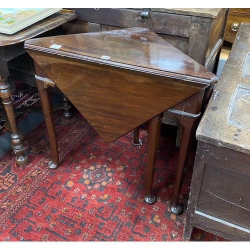 1186 - A 19th century triangular folding mahogany pad foot occasional table, width 79cm, depth 43cm, height... 