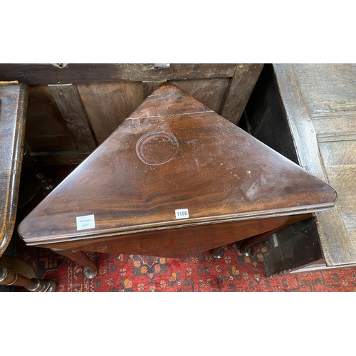 1186 - A 19th century triangular folding mahogany pad foot occasional table, width 79cm, depth 43cm, height... 