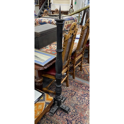 1193 - A pair of painted turned wood and wrought iron pricket candlestands, height 144cm