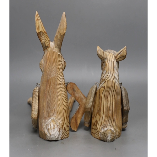 1250 - A pair of carved wood animal peg dolls, a hare and a sheep, hare tallest, 43cms high