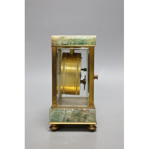 1254 - A French onyx and brass small mantel clock, with ornate enamel dial,14.5cms high