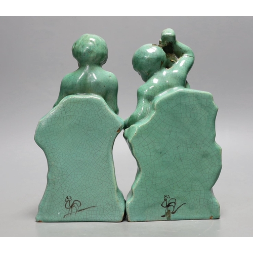 1255 - A pair of Cantagalli green monochrome putti figural bookends, 19cms high