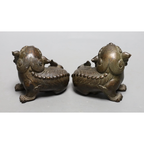 1256 - A pair of 18th/19th century Chinese or Japanese bronze lion-dog figures, 8cms high