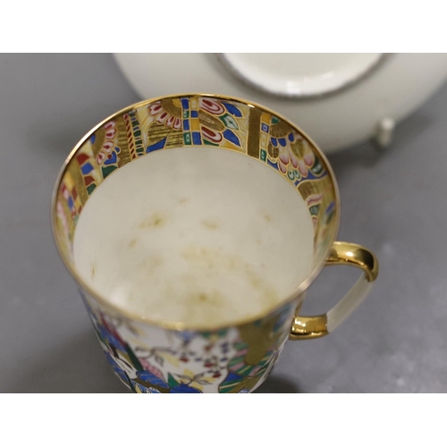 1264 - A Russian gilt enamel porcelain tea cup and saucer, cup 8cms high