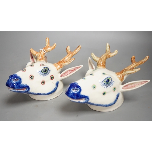 1292 - Two Continental pottery stag head wall pockets, 22cms high