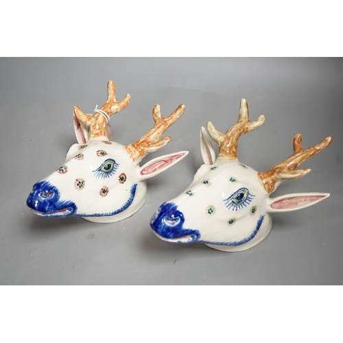 1292 - Two Continental pottery stag head wall pockets, 22cms high