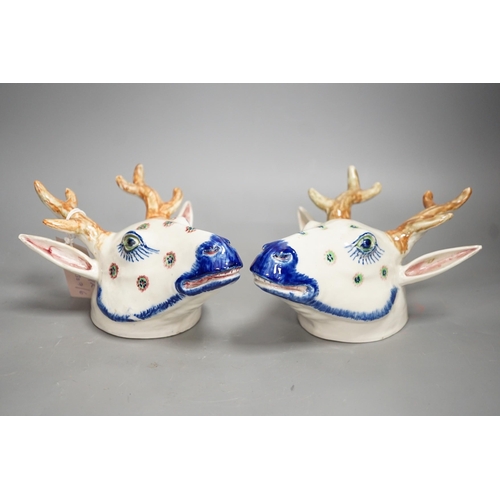 1292 - Two Continental pottery stag head wall pockets, 22cms high