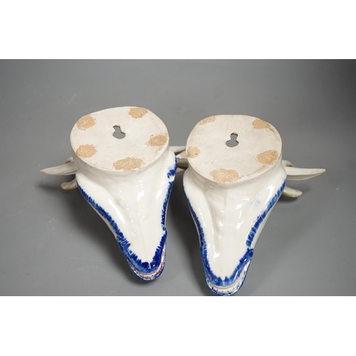 1292 - Two Continental pottery stag head wall pockets, 22cms high