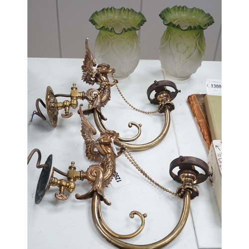 1298 - A pair of brass winged caryatid wall lights with green shades, 30cms deep