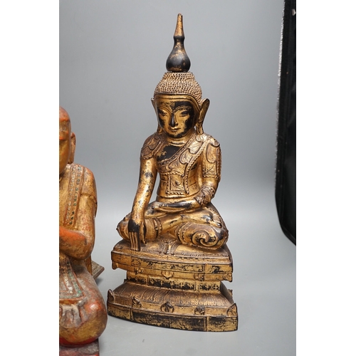 1307 - Two Thai gilt wood figures of Buddha, tallest 41cms high