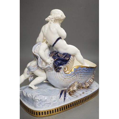 1308 - A Copeland porcelain putti seated on a shell centrepiece, modelled O. Hale, c.1877, 35cms high... 