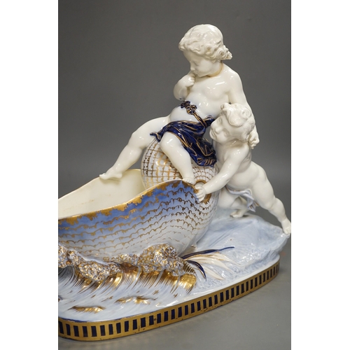 1308 - A Copeland porcelain putti seated on a shell centrepiece, modelled O. Hale, c.1877, 35cms high... 