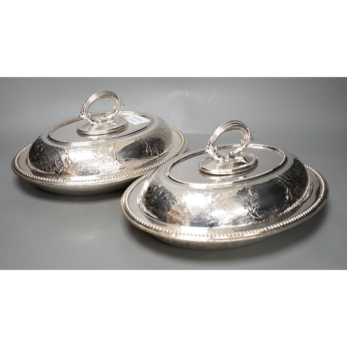 1323 - A pair of Edwardian plated engraved oval entree dishes and covers