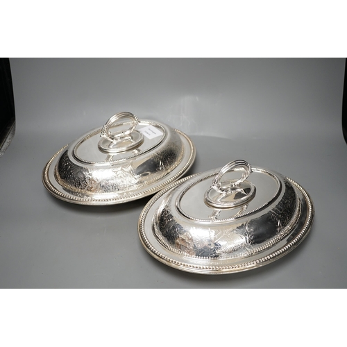 1323 - A pair of Edwardian plated engraved oval entree dishes and covers