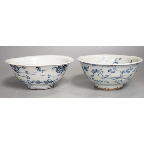 1332 - Two Chinese late Ming blue and white bowls, 16th/17th century, painted with flowers and foliage, 14.... 