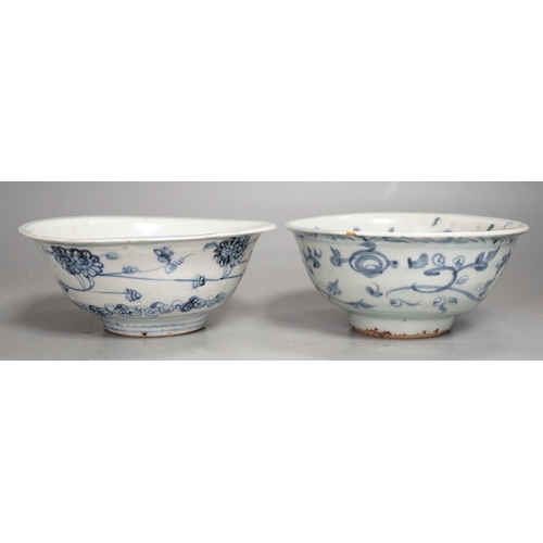 1332 - Two Chinese late Ming blue and white bowls, 16th/17th century, painted with flowers and foliage, 14.... 