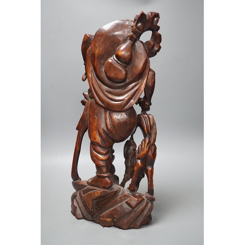 1360 - A large Chinese hardwood figure of Liu Hai, early 20th century, 47cm