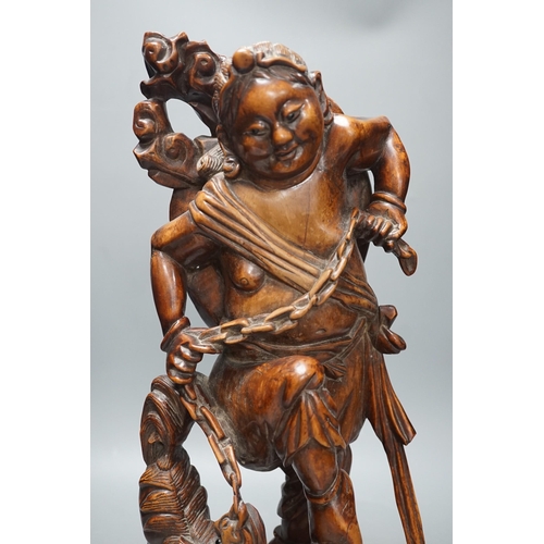 1360 - A large Chinese hardwood figure of Liu Hai, early 20th century, 47cm