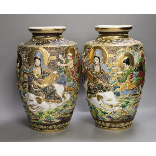 1361 - A pair of Japanese moulded and moriage decorated vases, 31cms