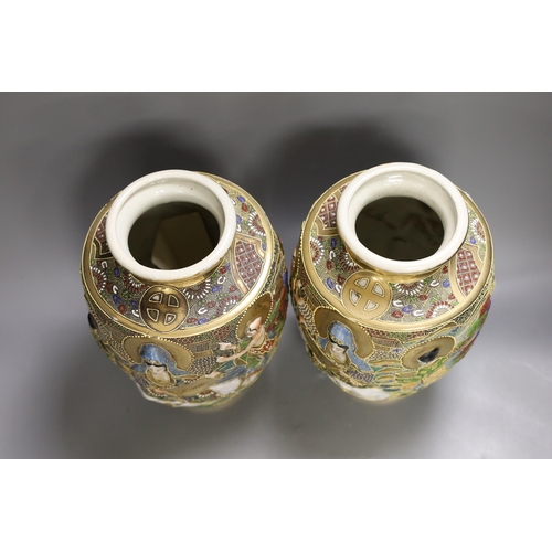 1361 - A pair of Japanese moulded and moriage decorated vases, 31cms