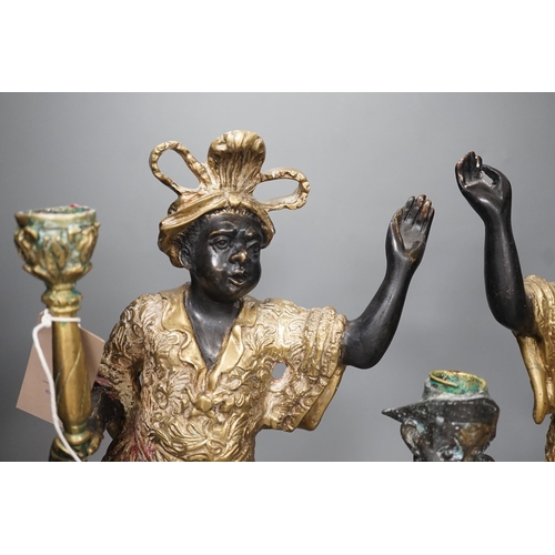 1366 - A pair of bronze blackamoor candlesticks and one other spelter figural candlestick, tallest 39cm... 