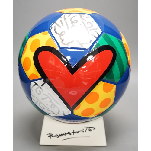 1374 - Romero Britto (Brazilian, 1963-), a ceramic football, 26cm