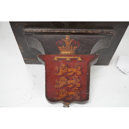 1375 - Four 19th century painted and ebonised heraldic wall brackets together with a 19th century armorial ... 