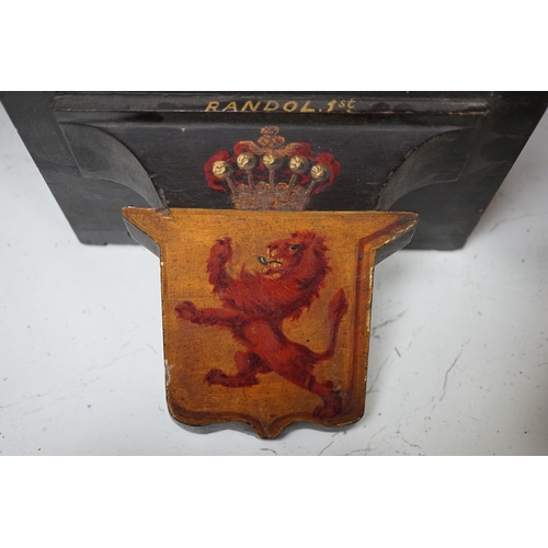 1375 - Four 19th century painted and ebonised heraldic wall brackets together with a 19th century armorial ... 