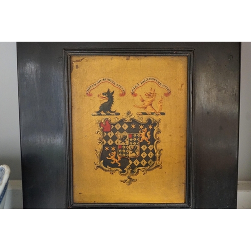 1375 - Four 19th century painted and ebonised heraldic wall brackets together with a 19th century armorial ... 