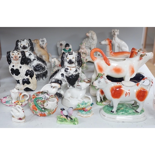 1380 - A quantity of Victorian Staffordshire animal figures, two pearlware putti and a Derby figure of a ch... 