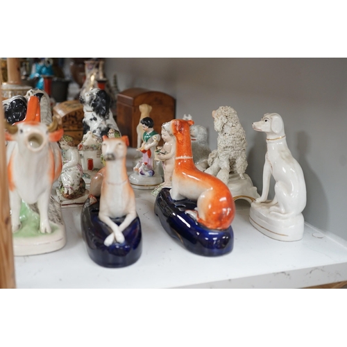 1380 - A quantity of Victorian Staffordshire animal figures, two pearlware putti and a Derby figure of a ch... 