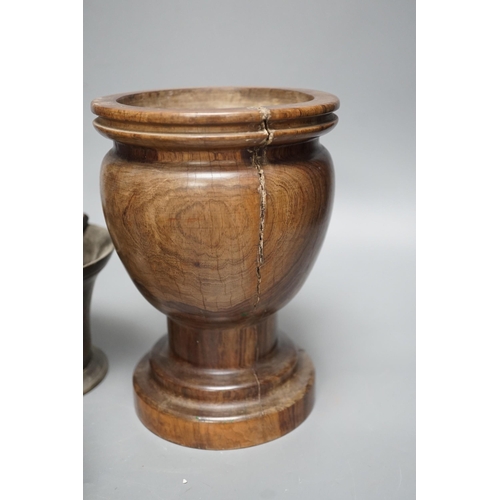 1385 - Three bell metal mortars, two pestles, a turned lignum vitae mortar and three postal weights, urn he... 