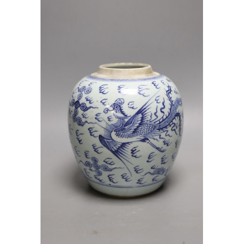 1404 - An 18th century Chinese provincial blue and white dragon and phoenix jar, 20cm high Provenance- the ... 