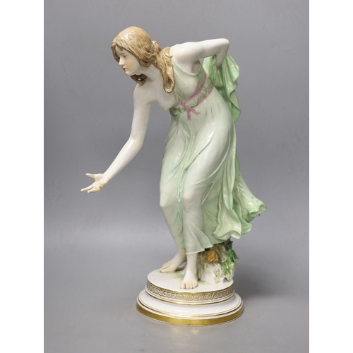 1408 - A Meissen Art Nouveau figurine of a young lady playing boules, early 20th century, modelled by Walte... 